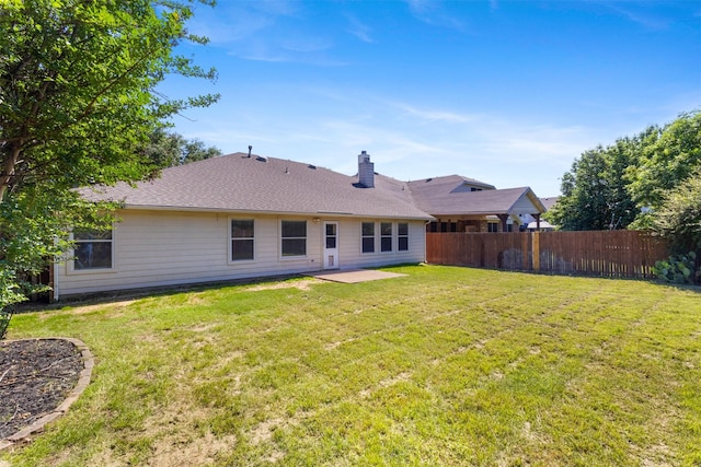 304 E Clover Park Dr, Fort Worth, TX 76140 - back of property featuring a chimney, a yard, a patio, and fence