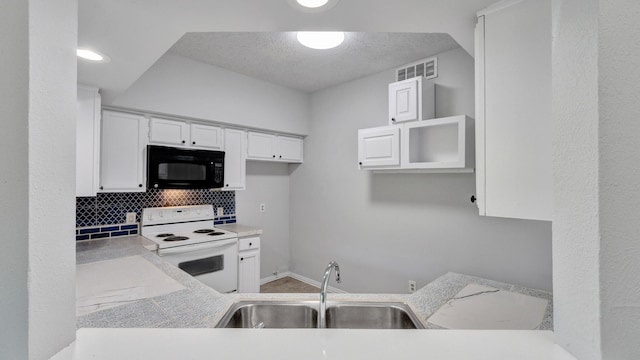 9601 Forest Ln Unit 1113, Dallas, TX 75243 - kitchen with black microwave, a sink, backsplash, visible vents, and white electric range