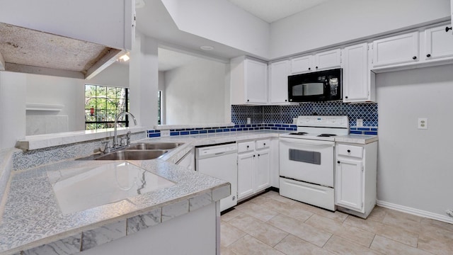 9601 Forest Ln Unit 1113, Dallas, TX 75243 - kitchen with backsplash, a sink, light countertops, white appliances, and white cabinetry