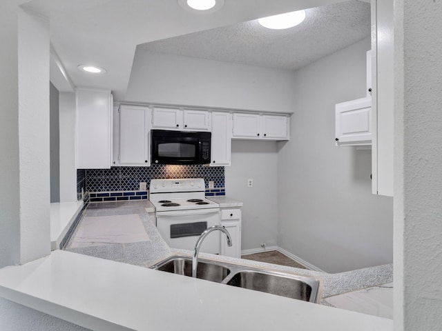 9601 Forest Ln Unit 1113, Dallas, TX 75243 - kitchen with electric range, black microwave, white cabinetry, a sink, and backsplash