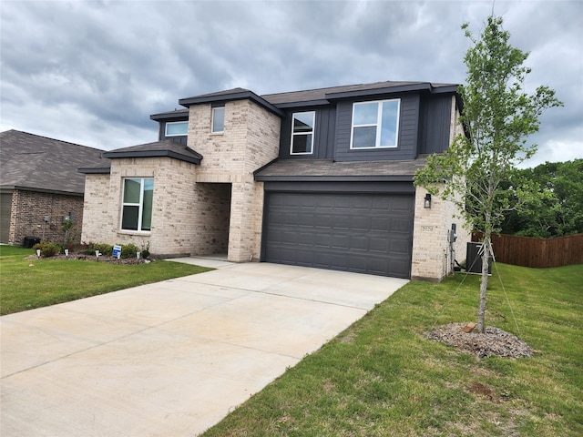 view of front of house featuring brick siding, fence, a garage, concrete driveway, and a front yard