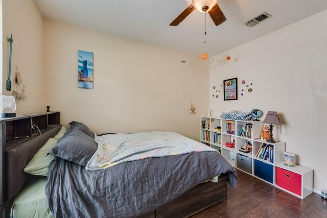 bedroom with wood finished floors and ceiling fan