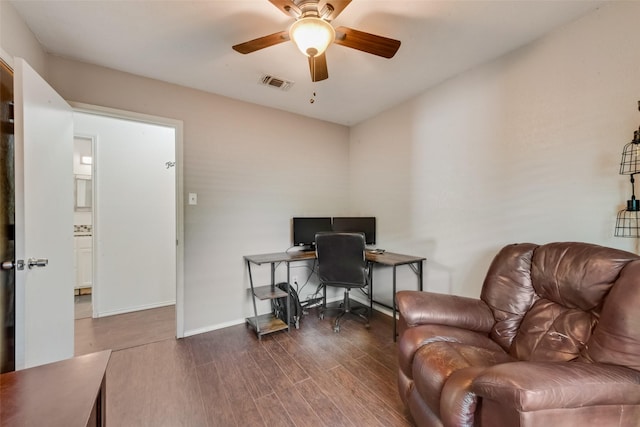 office featuring ceiling fan, wood finished floors, and baseboards