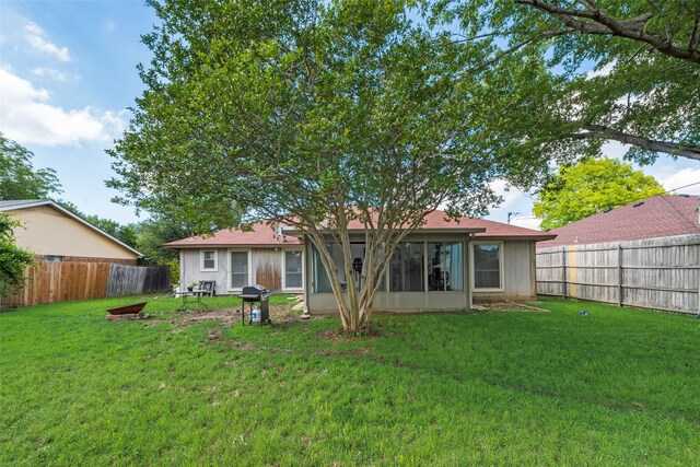 back of house featuring a sunroom