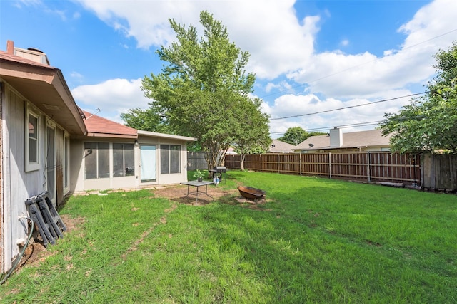 view of yard with a sunroom