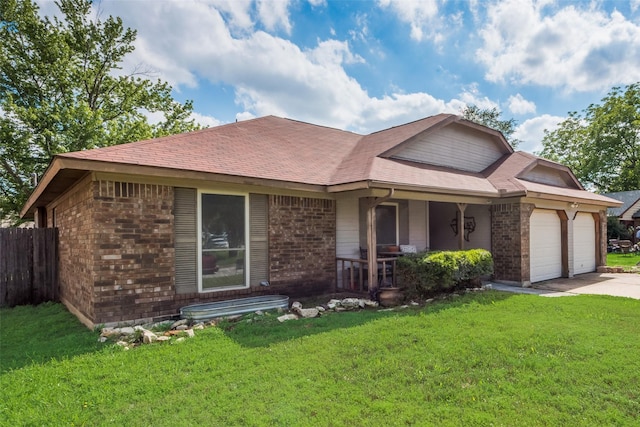 view of front of property featuring brick siding, a garage, covered porch, driveway, and roof with shingles