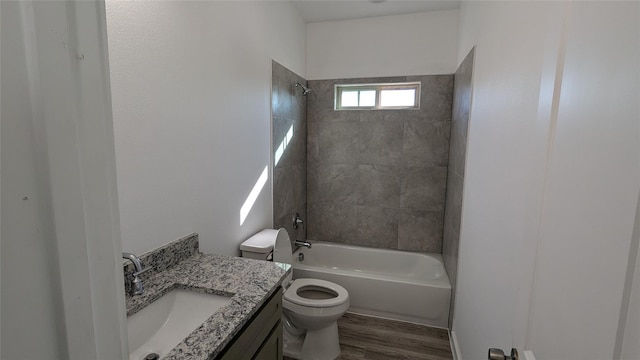 106 Sugar Ter, Runaway Bay, TX 76426 - bathroom with shower / bathing tub combination, vanity, toilet, and wood finished floors