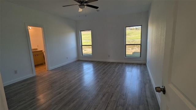 106 Sugar Ter, Runaway Bay, TX 76426 - empty room with dark wood finished floors, baseboards, and ceiling fan