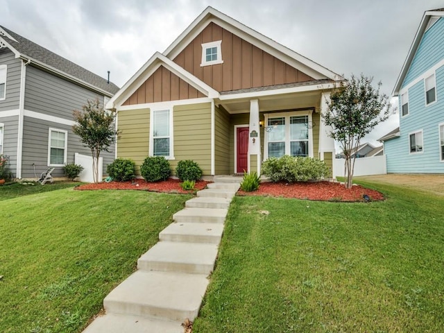 1909 Myers Ct, Providence Village, TX 76227 - view of front of house with a front lawn and board and batten siding