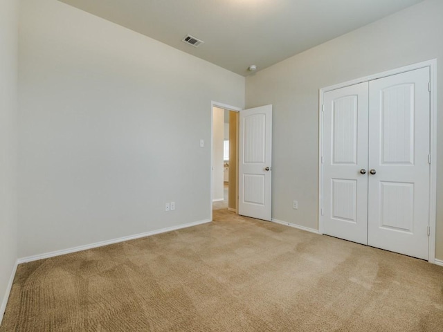 1909 Myers Ct, Providence Village, TX 76227 - unfurnished bedroom with baseboards, a closet, visible vents, and light colored carpet