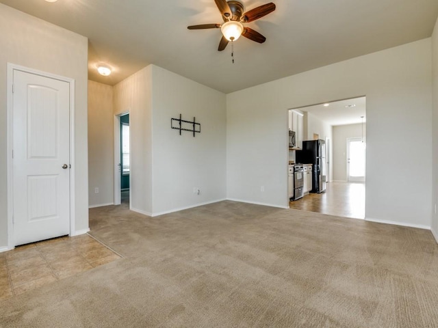 1909 Myers Ct, Providence Village, TX 76227 - empty room with light carpet, baseboards, and a ceiling fan