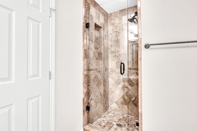 full bathroom with a shower stall