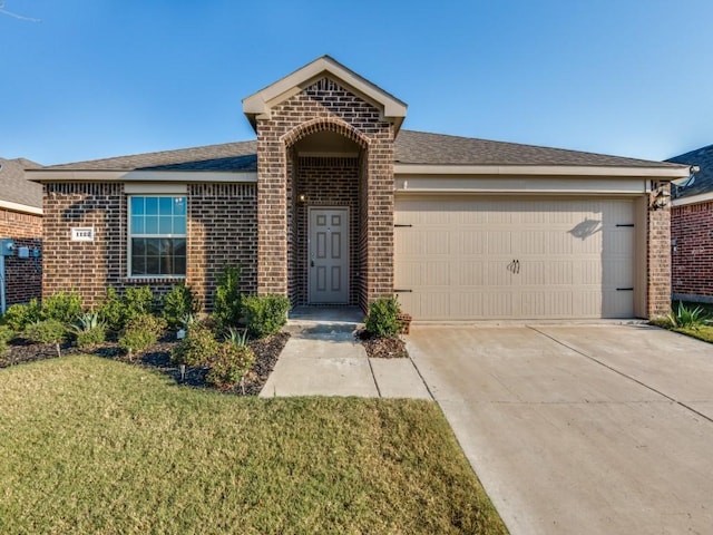single story home with concrete driveway, brick siding, a garage, and a front lawn