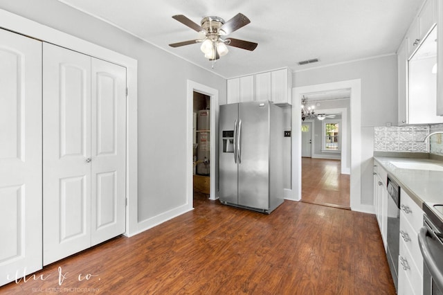 741 Vine St, Abilene, TX 79602 - kitchen with stainless steel appliances, a sink, white cabinetry, a chandelier, and dark wood-style flooring