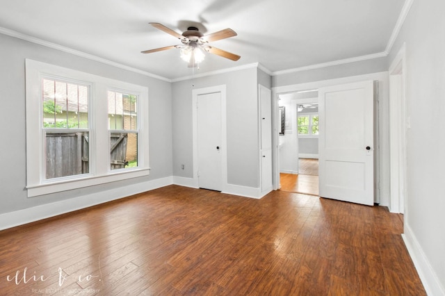 741 Vine St, Abilene, TX 79602 - unfurnished bedroom with hardwood / wood-style floors, baseboards, crown molding, and a ceiling fan