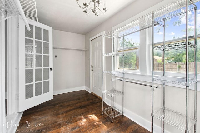 741 Vine St, Abilene, TX 79602 - walk in closet with dark wood-style floors and a chandelier
