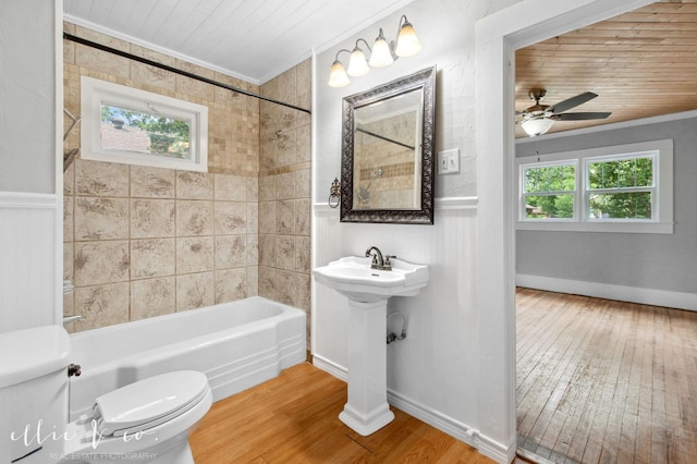 741 Vine St, Abilene, TX 79602 - full bath featuring toilet, hardwood / wood-style floors, shower / bathtub combination, crown molding, and a ceiling fan