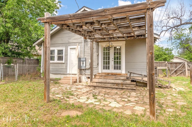 741 Vine St, Abilene, TX 79602 - rear view of property with entry steps, french doors, and a fenced backyard