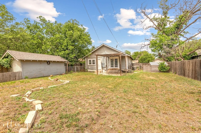 741 Vine St, Abilene, TX 79602 - rear view of property featuring french doors and an outdoor structure