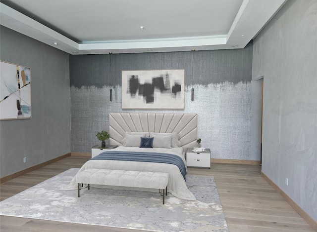 4625 Walnut Hill Ln, Dallas, TX 75229 - bedroom featuring an accent wall, baseboards, and wood finished floors