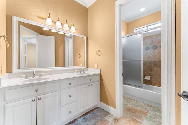bathroom with a sink, crown molding, and double vanity