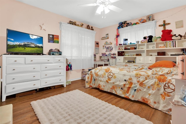 7634 Preston Rd, Denison, TX 75020 - bedroom featuring wood finished floors and a ceiling fan