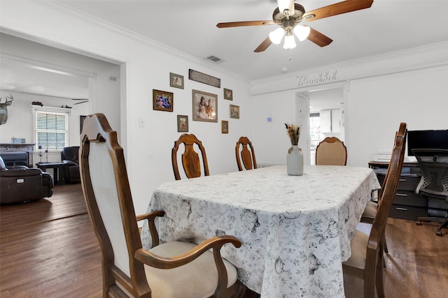 7634 Preston Rd, Denison, TX 75020 - dining space with ornamental molding, dark wood finished floors, and a ceiling fan