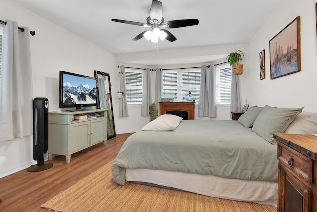 7634 Preston Rd, Denison, TX 75020 - bedroom featuring light wood-style flooring, baseboards, and a ceiling fan