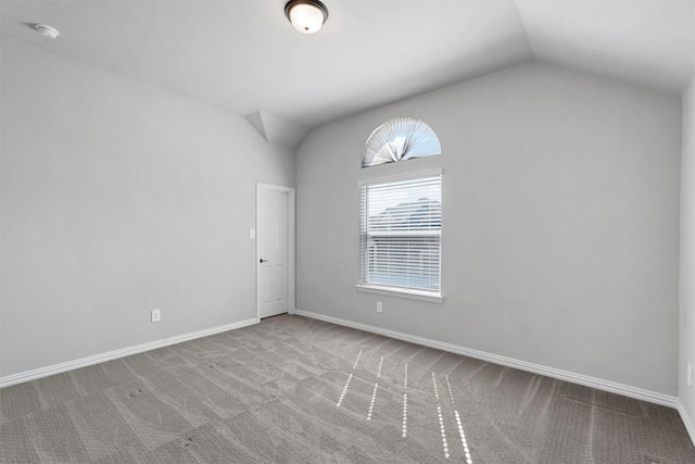 2506 Chalmers Rd, Glenn Heights, TX 75154 - spare room with lofted ceiling, carpet, a smoke detector, and baseboards