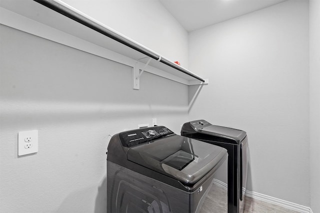 2506 Chalmers Rd, Glenn Heights, TX 75154 - laundry room featuring washer and clothes dryer and baseboards