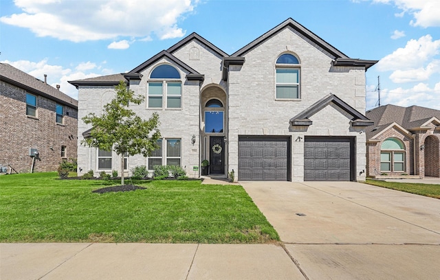 2506 Chalmers Rd, Glenn Heights, TX 75154 - view of front of house with an attached garage, a front lawn, concrete driveway, and brick siding