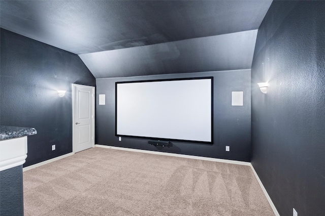 2507 Lavaca Dr, Euless, TX 76039 - carpeted home theater featuring lofted ceiling and baseboards