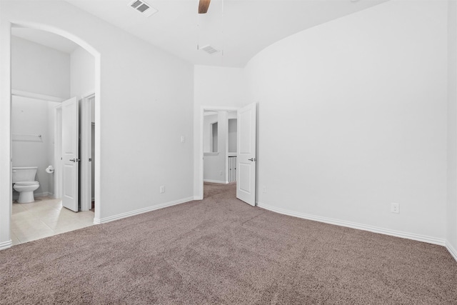 2507 Lavaca Dr, Euless, TX 76039 - unfurnished bedroom with light colored carpet, connected bathroom, baseboards, and ceiling fan