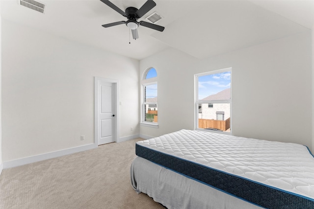 bedroom with baseboards, a ceiling fan, visible vents, and carpet floors