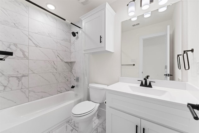 bathroom with toilet, marble finish floor, vanity, visible vents, and tub / shower combination
