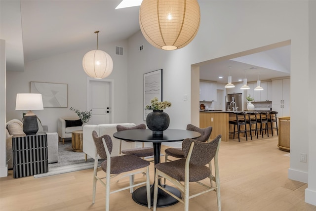 4508 Thunder Rd, Dallas, TX 75244 - dining room featuring light wood-style floors and high vaulted ceiling
