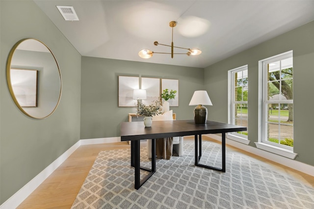 4508 Thunder Rd, Dallas, TX 75244 - office area featuring light wood-style floors, baseboards, and a chandelier