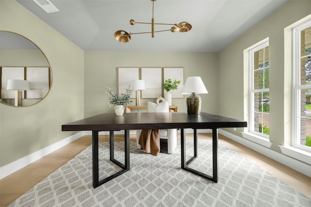 4508 Thunder Rd, Dallas, TX 75244 - office space with a chandelier, baseboards, and light wood-style flooring