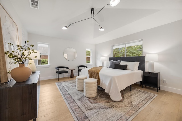 4508 Thunder Rd, Dallas, TX 75244 - bedroom with light wood-style flooring, baseboards, and rail lighting