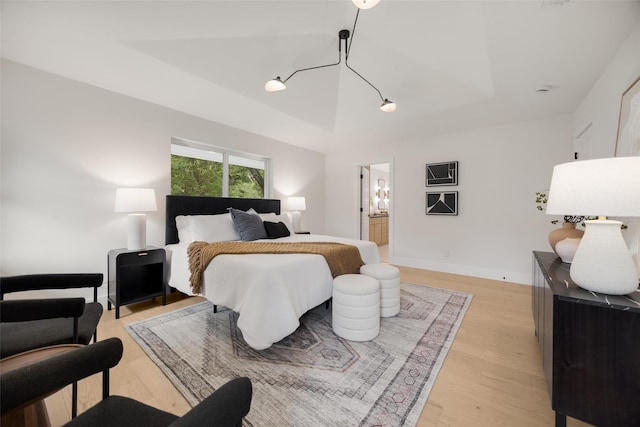 4508 Thunder Rd, Dallas, TX 75244 - bedroom with light wood-type flooring and connected bathroom
