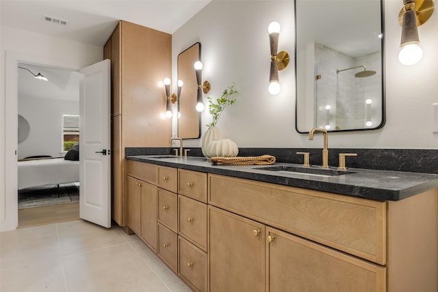 4508 Thunder Rd, Dallas, TX 75244 - bathroom featuring a tile shower, double vanity, tile patterned floors, and ensuite bathroom