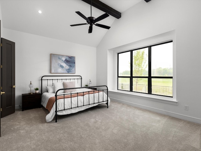 carpeted bedroom with baseboards, high vaulted ceiling, multiple windows, and beam ceiling