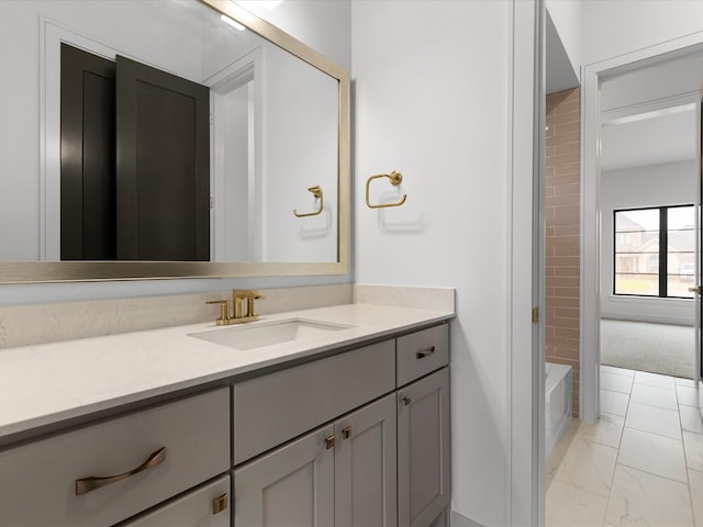 bathroom with marble finish floor and vanity