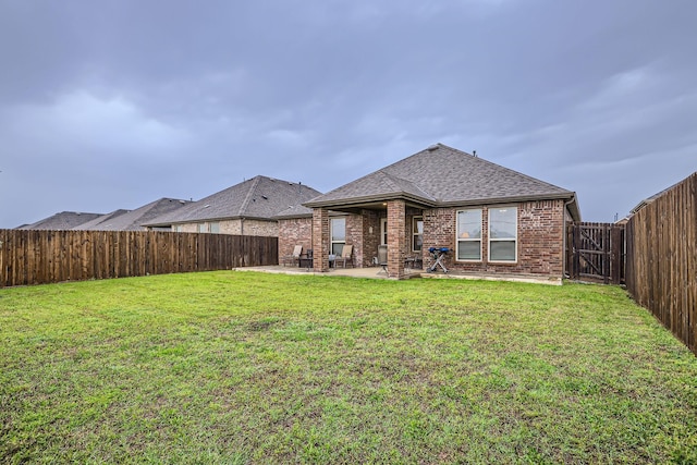 2828 Ainsworth Rd, Aubrey, TX 76227 - back of property with a patio, a shingled roof, and brick siding