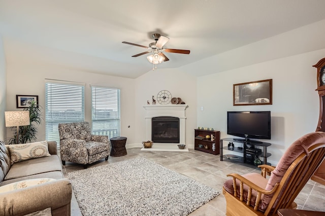 2828 Ainsworth Rd, Aubrey, TX 76227 - living room featuring ceiling fan, a glass covered fireplace, light tile patterned floors, and baseboards