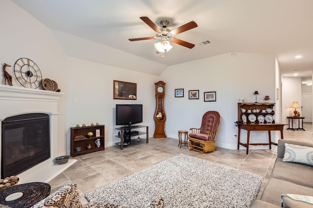 2828 Ainsworth Rd, Aubrey, TX 76227 - living area with lofted ceiling, a ceiling fan, light tile patterned floors, a glass covered fireplace, and baseboards
