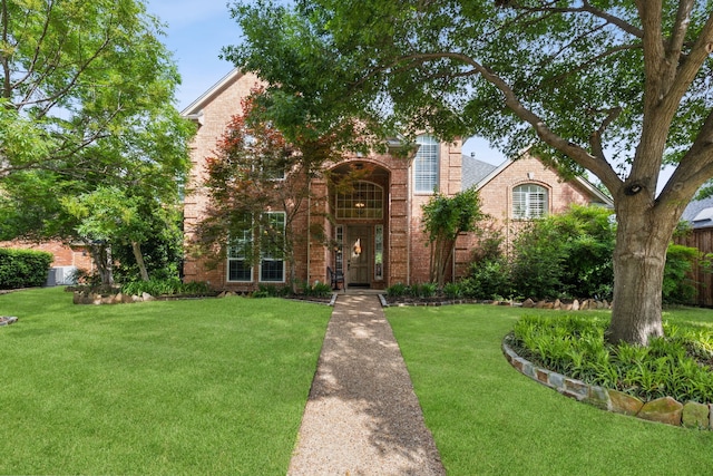 308 Dunlin Ln, Coppell, TX 75019 - traditional home featuring brick siding and a front lawn