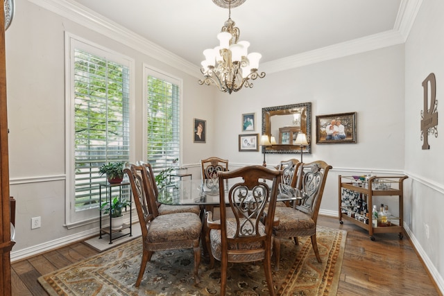 308 Dunlin Ln, Coppell, TX 75019 - dining space with ornamental molding, a notable chandelier, baseboards, and wood finished floors