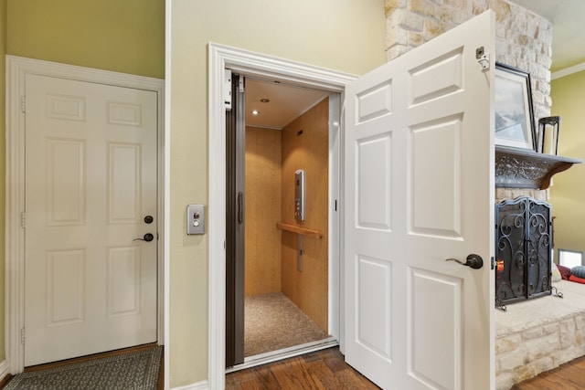 308 Dunlin Ln, Coppell, TX 75019 - interior space featuring elevator and dark wood-style flooring
