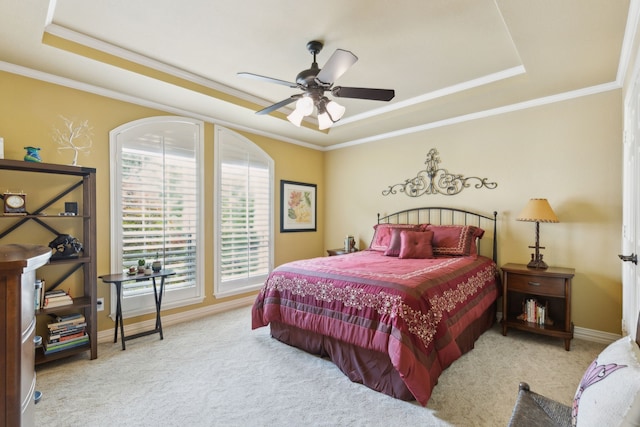 308 Dunlin Ln, Coppell, TX 75019 - carpeted bedroom with a tray ceiling, crown molding, baseboards, and ceiling fan